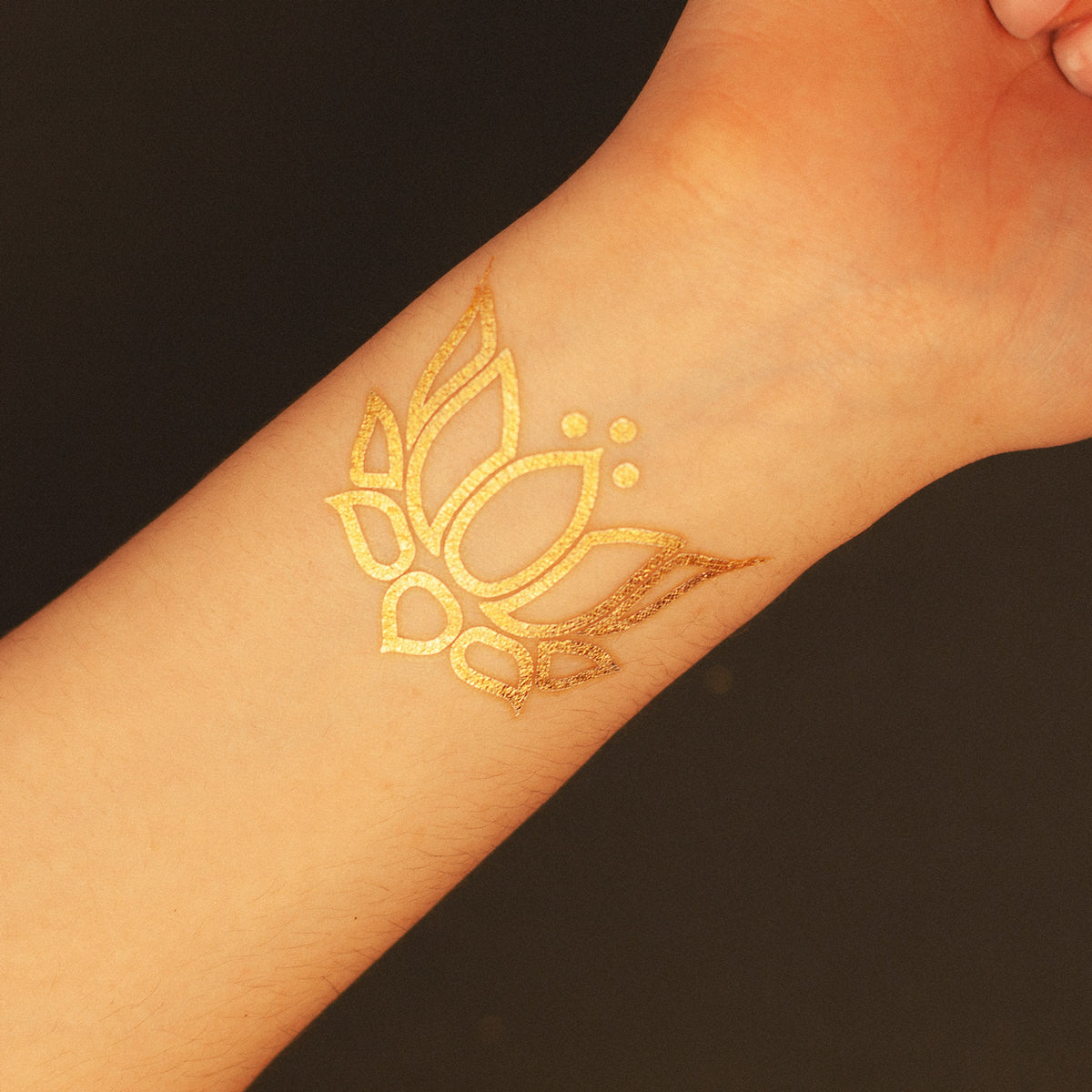 lotus flower golden tattoo