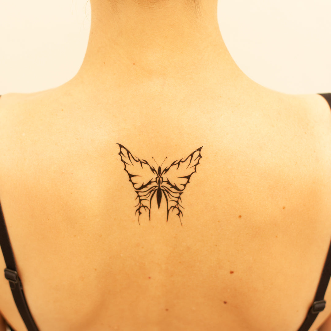 tribal butterfly tattoo