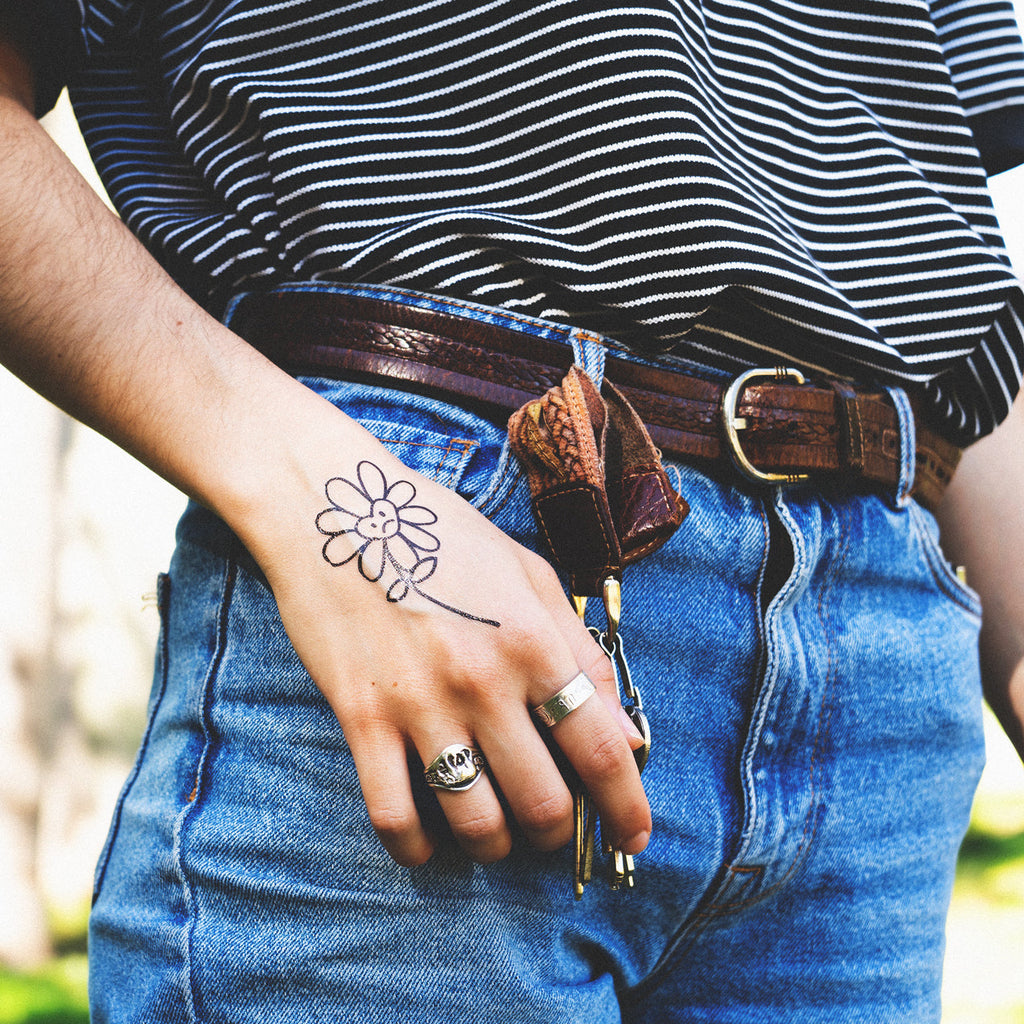 sad flower tattoo