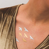 tatuaje pájaros metalizado
