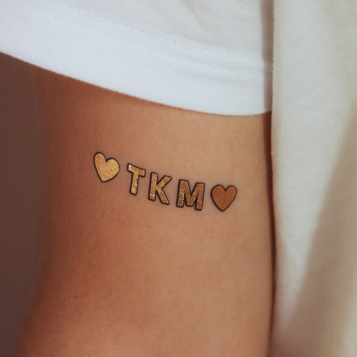 tatuaje dorado tkm