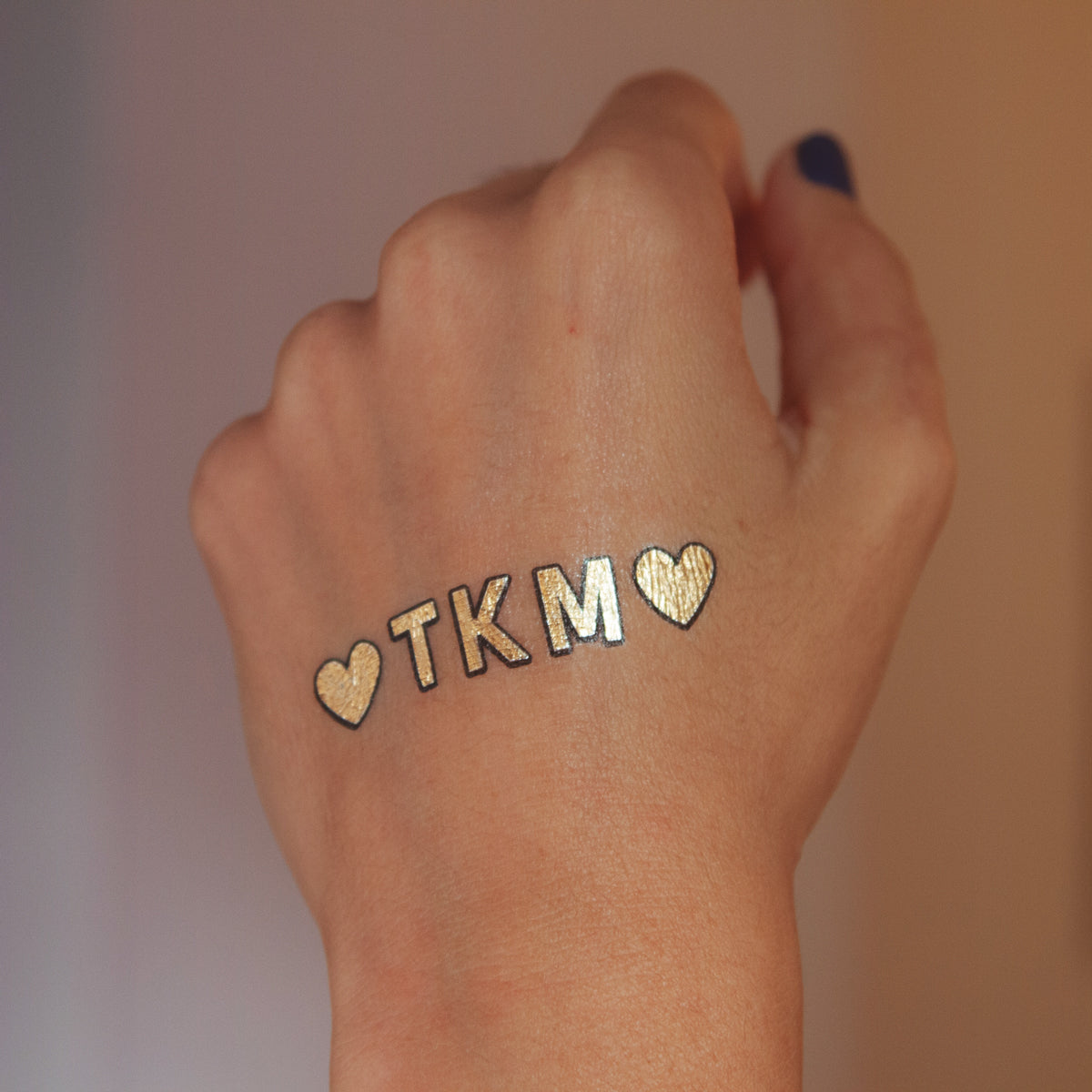 tatuaje dorado tkm